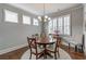 Cozy dining room features hardwood floors, crown molding, and large windows with plantation shutters at 407 After Glow Smt, Canton, GA 30114