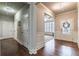 Hallway with hardwood flooring, wainscoting, and access to various rooms, including the office and front entrance at 407 After Glow Smt, Canton, GA 30114