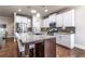 Modern kitchen featuring stainless steel appliances, granite countertops, and a center island with seating at 407 After Glow Smt, Canton, GA 30114