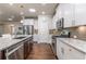 Bright kitchen featuring stainless steel appliances, granite countertops, and hardwood floors at 407 After Glow Smt, Canton, GA 30114