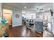 Open-concept living room with hardwood floors seamlessly flowing into the kitchen and dining area at 407 After Glow Smt, Canton, GA 30114