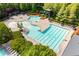 Community swimming pool with lap lanes, sun loungers, and a water slide for summer fun at 407 After Glow Smt, Canton, GA 30114