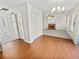 Open dining area with wood floors offering a view of the living room and convenient access to other rooms at 380 Birchmere Sw, Atlanta, GA 30331