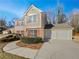 Exterior of a two-story home showcasing a two-car garage and landscaped front yard at 380 Birchmere Sw, Atlanta, GA 30331