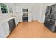 Bright kitchen with stainless steel appliances, white cabinets, and durable vinyl floors at 380 Birchmere Sw, Atlanta, GA 30331
