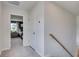 Hallway leading into a bedroom with carpeted floors and neutral color palette at 405 Newland Way, Acworth, GA 30102