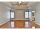 Spacious bedroom featuring gray walls, trey ceilings, wood-look floors and natural light from two windows at 4270 Fallbrook Dr, Duluth, GA 30096