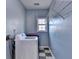 Laundry room with washer and dryer and metal shelving for optimal utility and space at 4270 Fallbrook Dr, Duluth, GA 30096