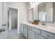 Bathroom with double sink vanity, granite countertops, contemporary fixtures and decorative mirrors at 5955 Misty Hill Ln, Buford, GA 30518