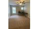 Bedroom featuring a ceiling fan, desk and carpeted flooring at 124 Streamside Dr # 24, Roswell, GA 30076