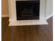 A cozy fireplace with tile trim and hearth at 124 Streamside Dr # 24, Roswell, GA 30076