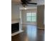 Cozy living room with fireplace and great natural light at 124 Streamside Dr # 24, Roswell, GA 30076