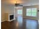 Spacious living room features a fireplace and large windows at 124 Streamside Dr # 24, Roswell, GA 30076