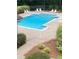 Inviting community pool surrounded by lush greenery, perfect for relaxation and recreation at 124 Streamside Dr # 24, Roswell, GA 30076
