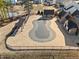 Aerial view of a covered community pool featuring an expansive deck, cabana, and wrought iron fence at 2207 Derbyshire Sw Dr, Marietta, GA 30064