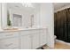 Bright bathroom featuring a large mirror, modern fixtures, and ample cabinet space at 2207 Derbyshire Sw Dr, Marietta, GA 30064