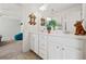 Bright bathroom featuring double sinks, modern fixtures, and ample cabinet space at 2207 Derbyshire Sw Dr, Marietta, GA 30064