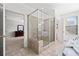 Bathroom with shower in a glass enclosure and door that leads to a large bedroom at 2207 Derbyshire Sw Dr, Marietta, GA 30064