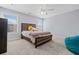 Bedroom featuring neutral colored walls, modern light fixtures, and two windows for natural light at 2207 Derbyshire Sw Dr, Marietta, GA 30064