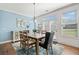 Dining area with natural light and views of the backyard and French doors at 2207 Derbyshire Sw Dr, Marietta, GA 30064