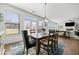 Bright dining room featuring a wooden table with seating for six, and large windows for ample natural light at 2207 Derbyshire Sw Dr, Marietta, GA 30064