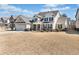 Inviting two-story home with a manicured lawn, showcasing an attached garage and appealing facade at 2207 Derbyshire Sw Dr, Marietta, GA 30064