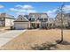 Charming two-story home with mature landscaping, a two-car garage, and inviting curb appeal at 2207 Derbyshire Sw Dr, Marietta, GA 30064