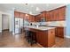 Modern kitchen featuring stainless steel appliances, granite countertops, an island with seating, and abundant cabinet space at 2207 Derbyshire Sw Dr, Marietta, GA 30064