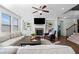 Bright living room boasts a fireplace, built-in shelves, and hardwood floors for elegant living at 2207 Derbyshire Sw Dr, Marietta, GA 30064