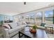 Bright living room with large windows, a sectional sofa, and stylish decor for relaxed living at 2207 Derbyshire Sw Dr, Marietta, GA 30064