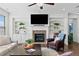 Inviting living room featuring a fireplace, custom shelving, and comfortable seating at 2207 Derbyshire Sw Dr, Marietta, GA 30064