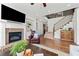 Cozy living room featuring a fireplace, built-in shelving, and a comfortable leather armchair at 2207 Derbyshire Sw Dr, Marietta, GA 30064