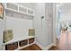 Mudroom featuring custom built-ins with hooks, shelves, and storage baskets at 2207 Derbyshire Sw Dr, Marietta, GA 30064