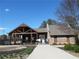 Community pool house with a brick fireplace, vaulted roof, and gated entrance on a sunny day at 2207 Derbyshire Sw Dr, Marietta, GA 30064