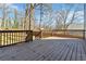 Large back deck overlooking a fenced backyard, perfect for outdoor entertaining at 2395 Saint James Nw Dr, Atlanta, GA 30318