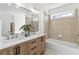 Luxurious bathroom featuring double sinks, warm lighting, and a soaking tub at 2395 Saint James Nw Dr, Atlanta, GA 30318