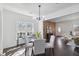 Dining area features a contemporary chandelier, hardwood floors, plenty of natural light, and an open floor plan at 2395 Saint James Nw Dr, Atlanta, GA 30318