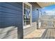 Exterior detail showing the wood plank siding and a porch with a wood floor at 2395 Saint James Nw Dr, Atlanta, GA 30318