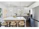 Kitchen with island seating, stainless steel appliances, hardwood floors, and recessed lighting at 2395 Saint James Nw Dr, Atlanta, GA 30318