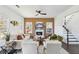 Bright living room with dark floors, fireplace, and modern furniture at 2395 Saint James Nw Dr, Atlanta, GA 30318