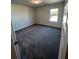 Neutral bedroom with carpet and a window for natural light at 3687 Lockaby Way, Lawrenceville, GA 30044