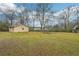 Large backyard featuring a shed and ample green space, ideal for gardening or recreation at 381 Gates Mil Dr, Lawrenceville, GA 30045