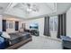 Main bedroom with ceiling fan and tray ceiling at 381 Gates Mil Dr, Lawrenceville, GA 30045