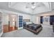 Main bedroom featuring decorative ceilings, a ceiling fan, and access to other rooms at 381 Gates Mil Dr, Lawrenceville, GA 30045