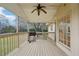 Charming covered porch with a grill, ceiling fan, and access to backyard at 381 Gates Mil Dr, Lawrenceville, GA 30045