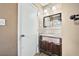 Bathroom features a vanity with a sink, mirror, and tile backsplash at 2122 Kimberly Sw Rd, Atlanta, GA 30331