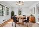 Bright dining room with hardwood floors, natural light, and seating for four at 2122 Kimberly Sw Rd, Atlanta, GA 30331