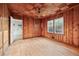 Cozy living room with wood paneling on the walls and ceiling and hardwood floors at 2122 Kimberly Sw Rd, Atlanta, GA 30331