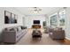 Bright living room with large window, ceiling fan, neutral walls, and modern furniture at 2122 Kimberly Sw Rd, Atlanta, GA 30331