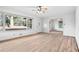 Bright living room with hardwood floors, a ceiling fan, and a large window at 2122 Kimberly Sw Rd, Atlanta, GA 30331